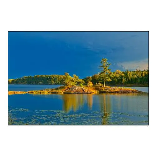 Canada-Ontario-Kenora District Forest Autumn Colors Reflect on Middle Lake at Sunset
