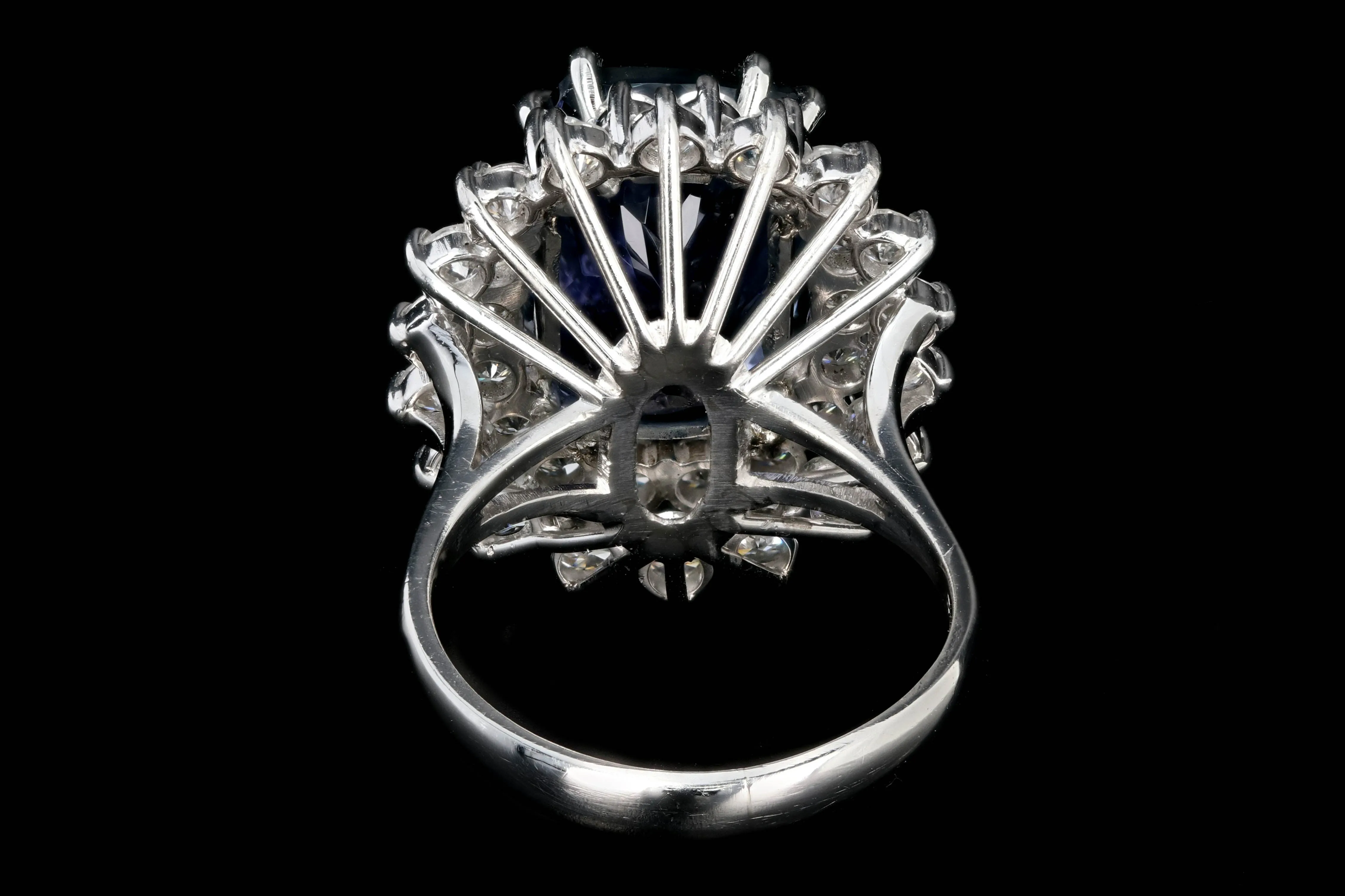 Modern Platinum 9.51 Tanzanite and Diamond Halo Ring