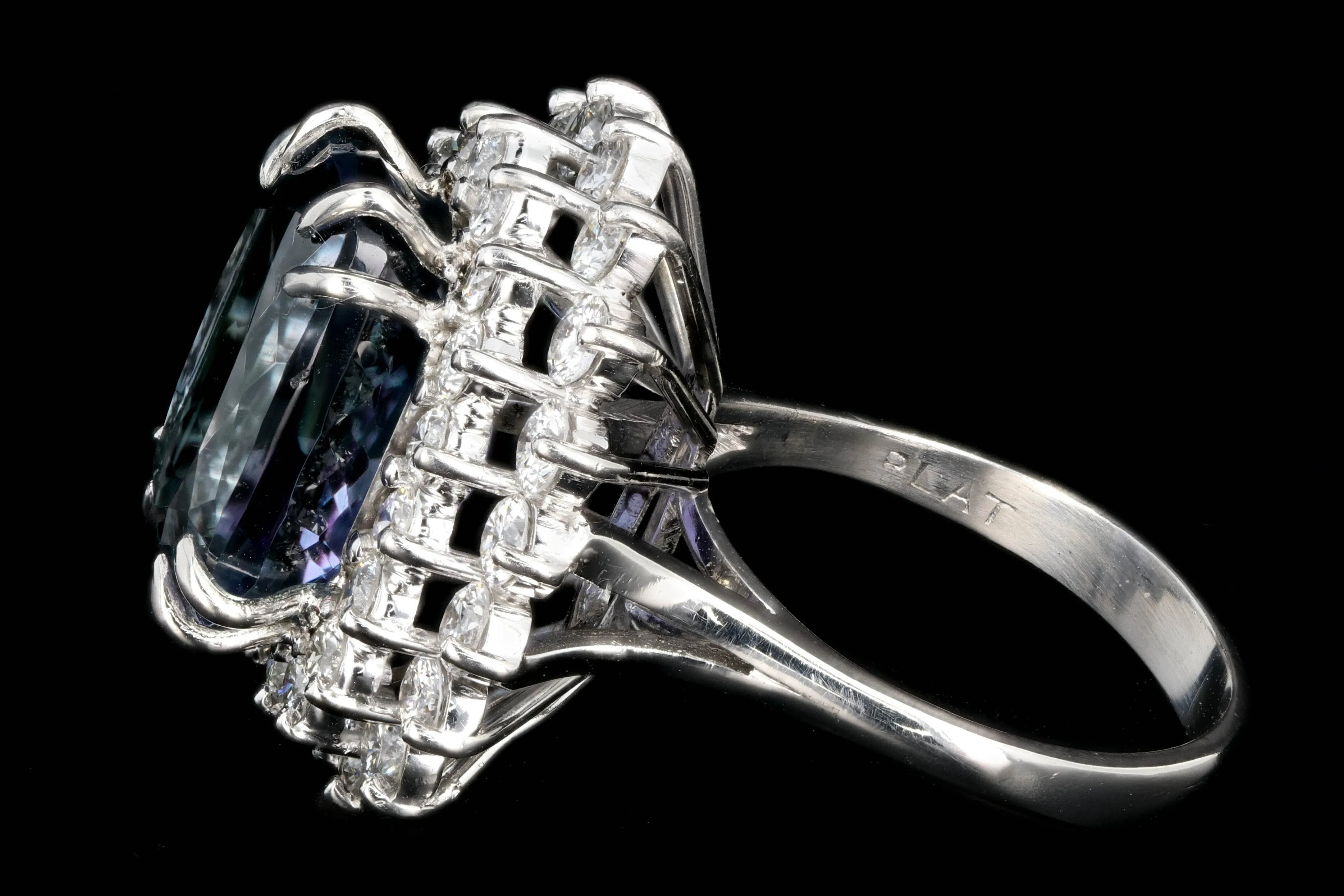 Modern Platinum 9.51 Tanzanite and Diamond Halo Ring