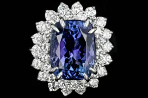 Modern Platinum 9.51 Tanzanite and Diamond Halo Ring