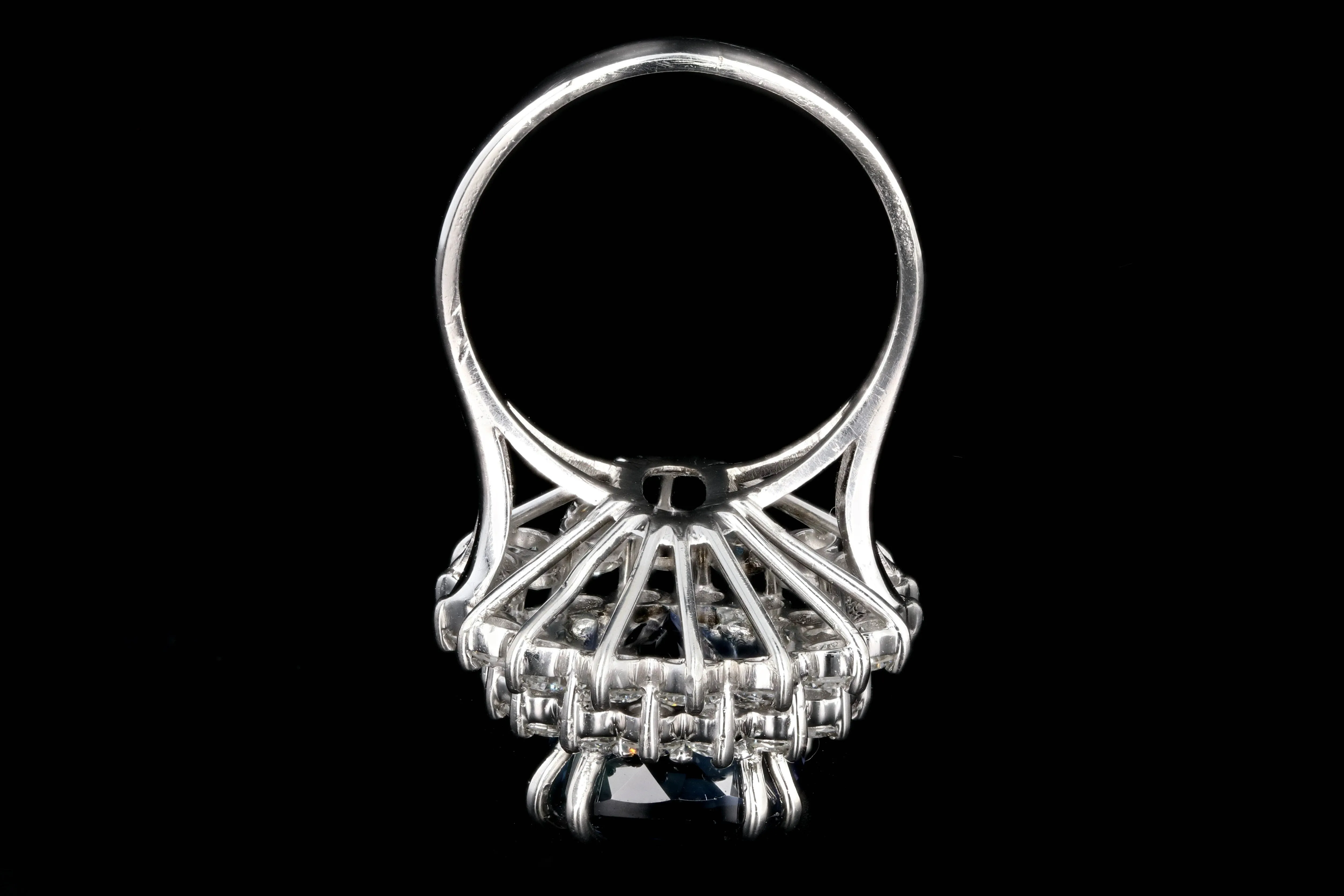 Modern Platinum 9.51 Tanzanite and Diamond Halo Ring