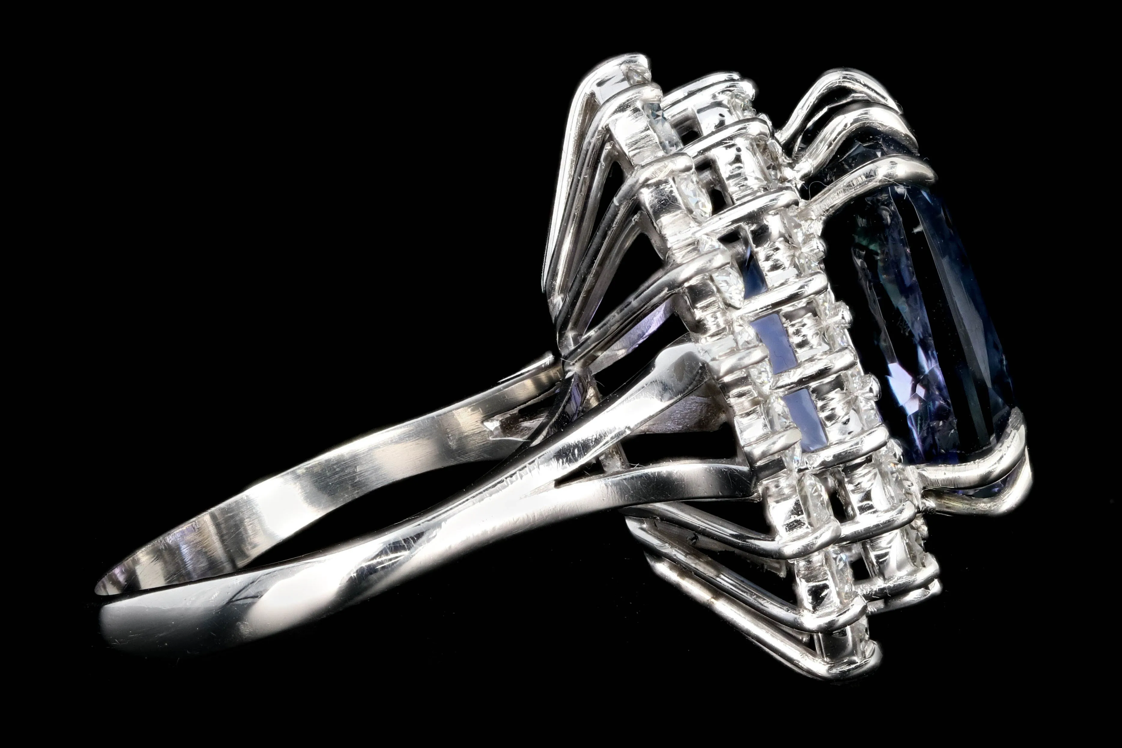 Modern Platinum 9.51 Tanzanite and Diamond Halo Ring