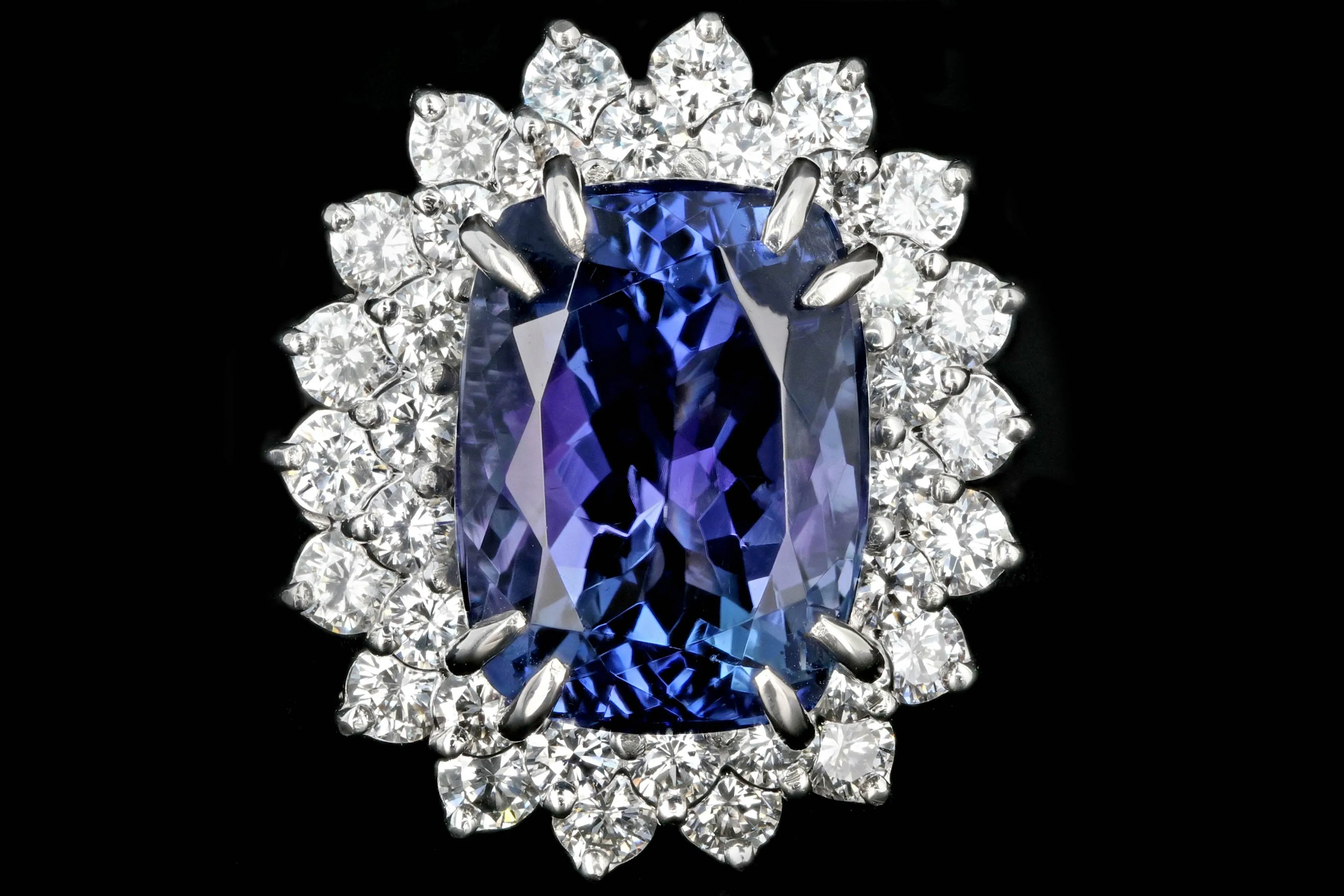 Modern Platinum 9.51 Tanzanite and Diamond Halo Ring
