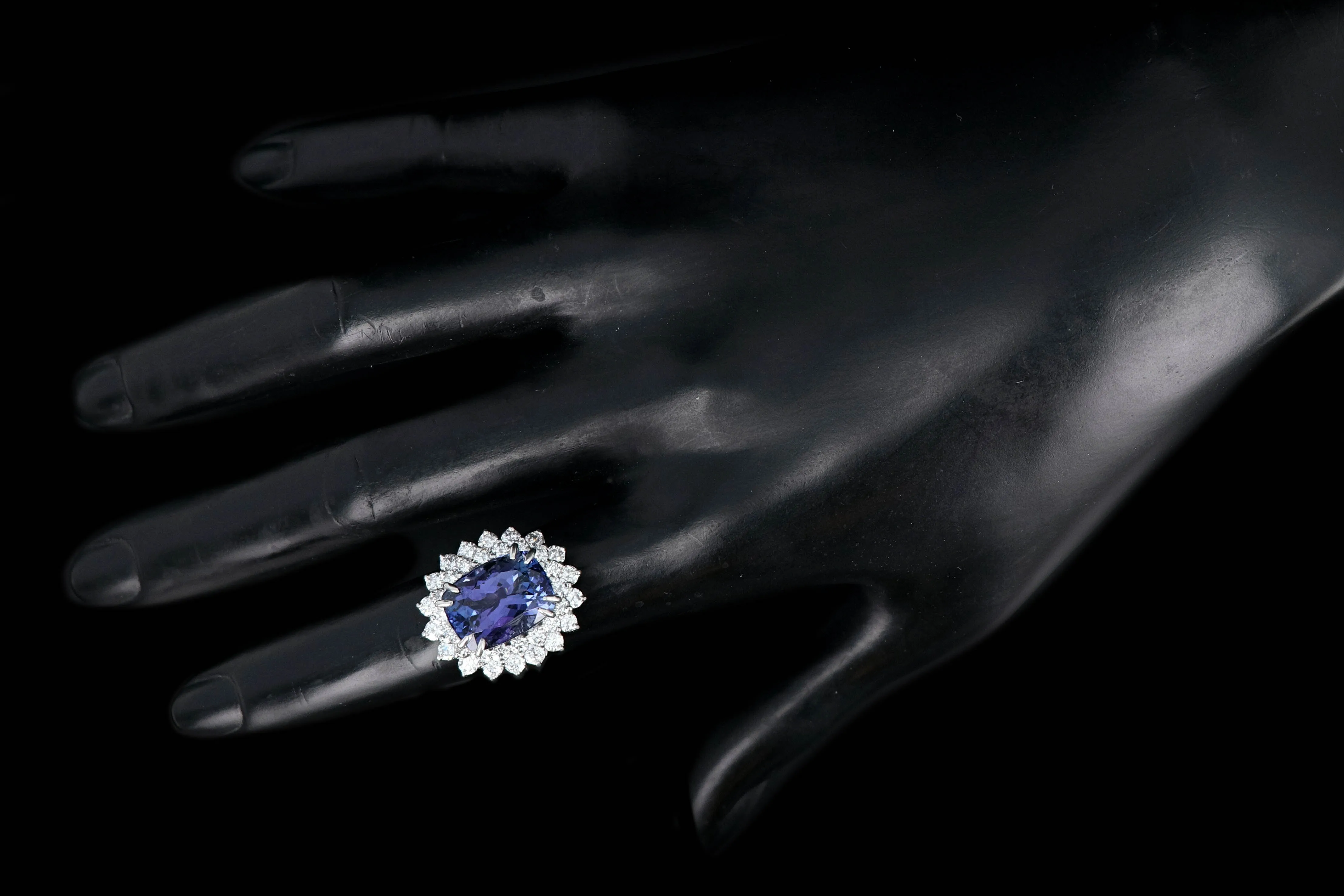 Modern Platinum 9.51 Tanzanite and Diamond Halo Ring