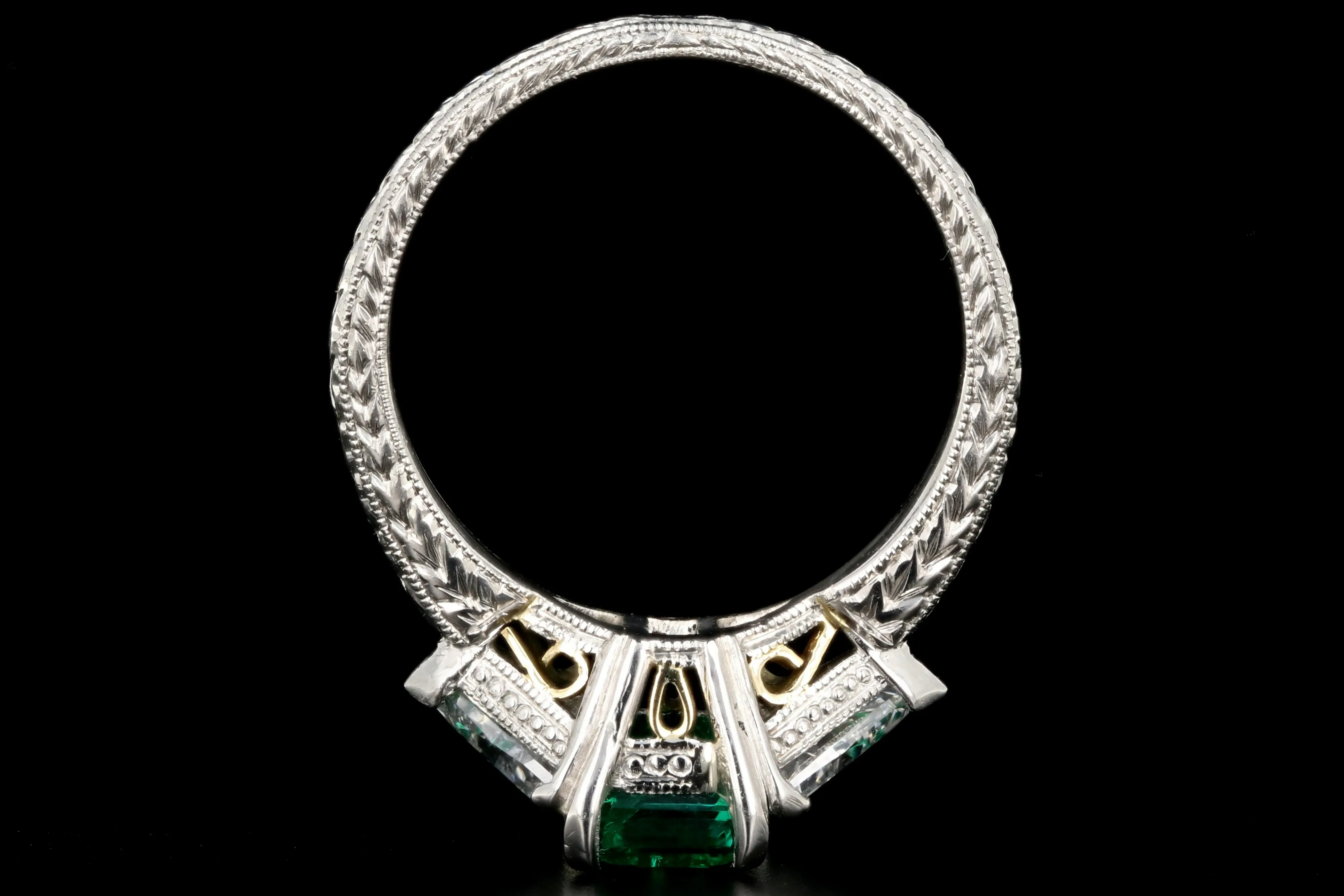 Modern Platinum and 18K Yellow Gold 1 Carat Emerald and Trillion Cut Diamond Ring