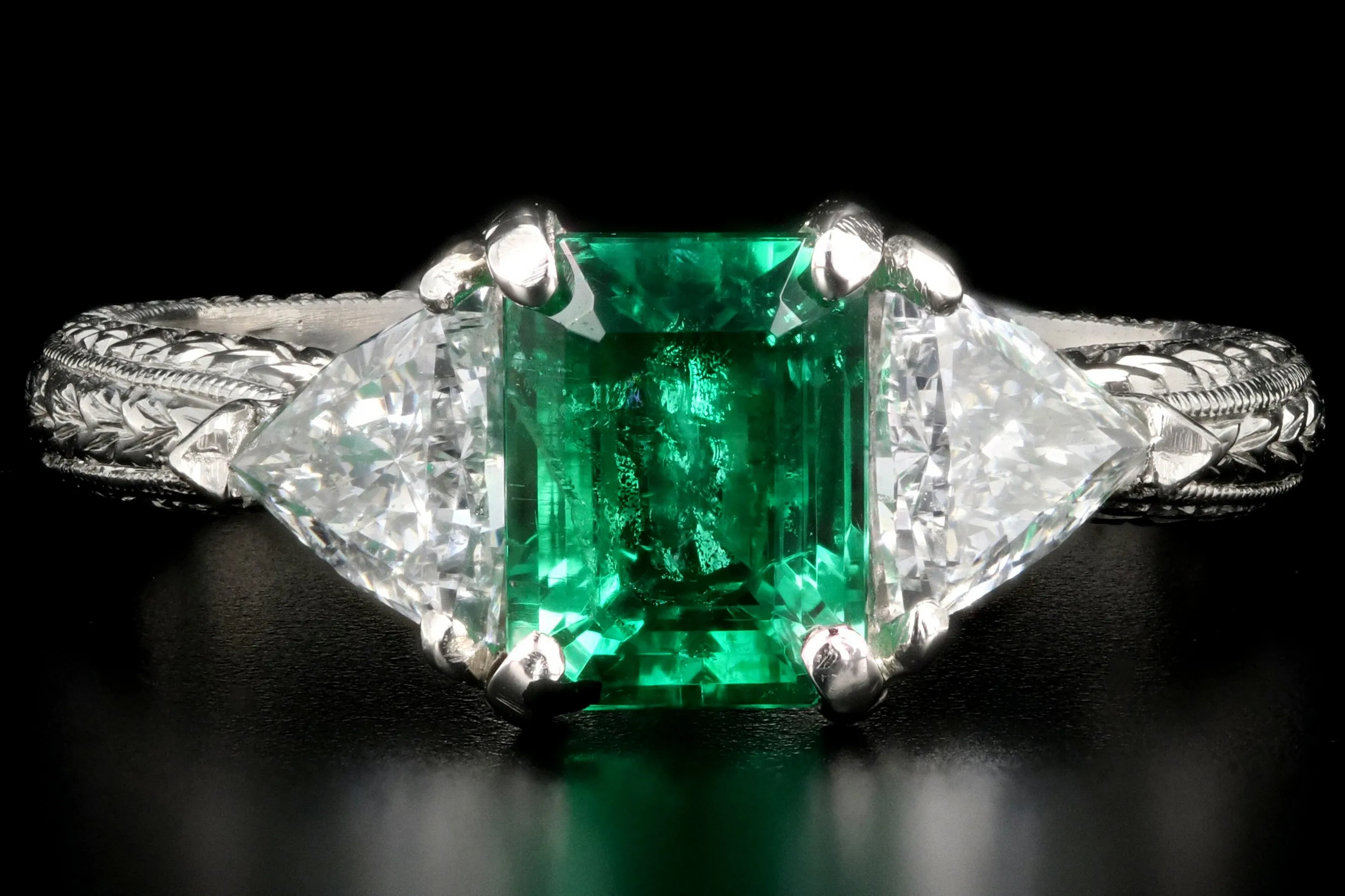 Modern Platinum and 18K Yellow Gold 1 Carat Emerald and Trillion Cut Diamond Ring