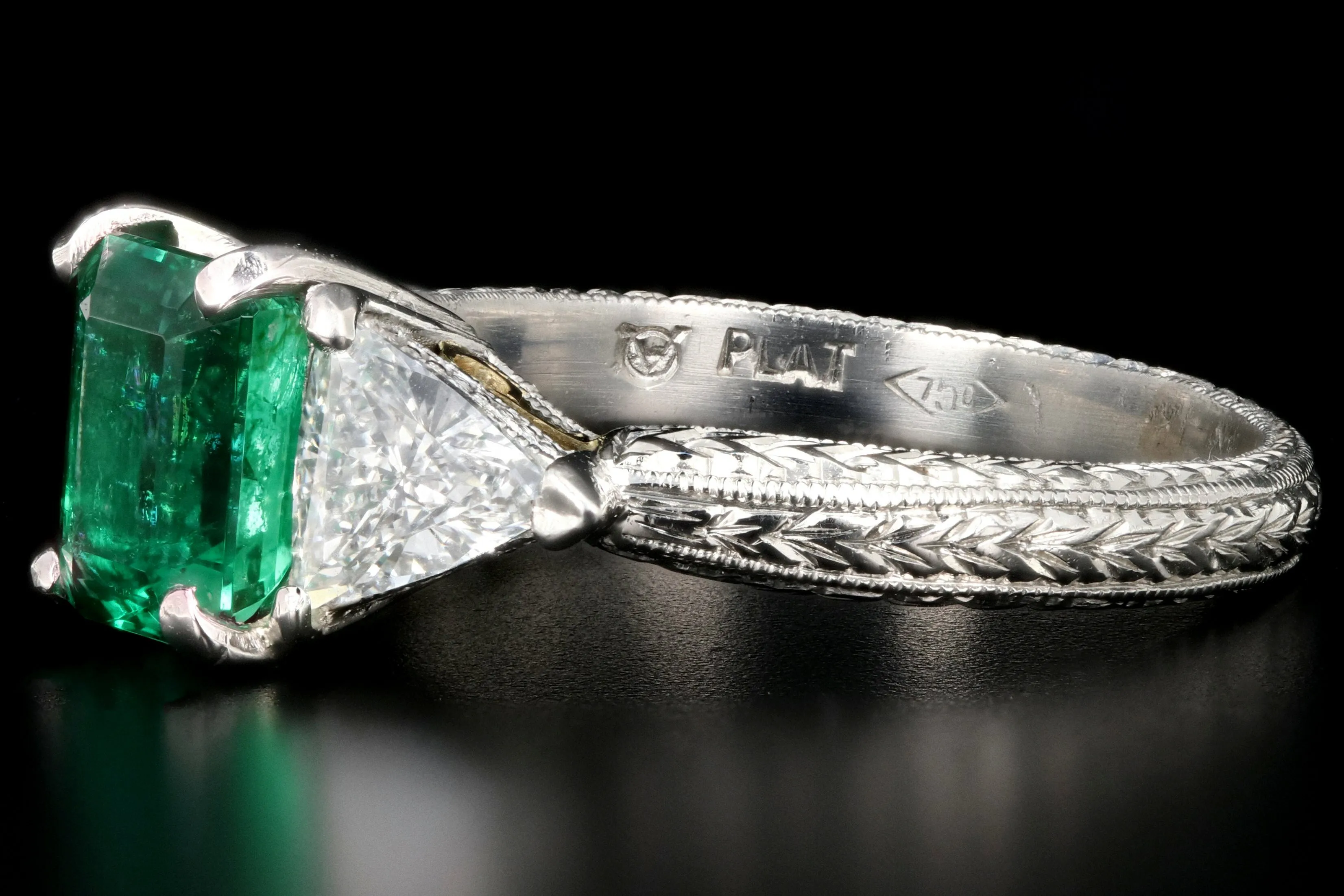 Modern Platinum and 18K Yellow Gold 1 Carat Emerald and Trillion Cut Diamond Ring