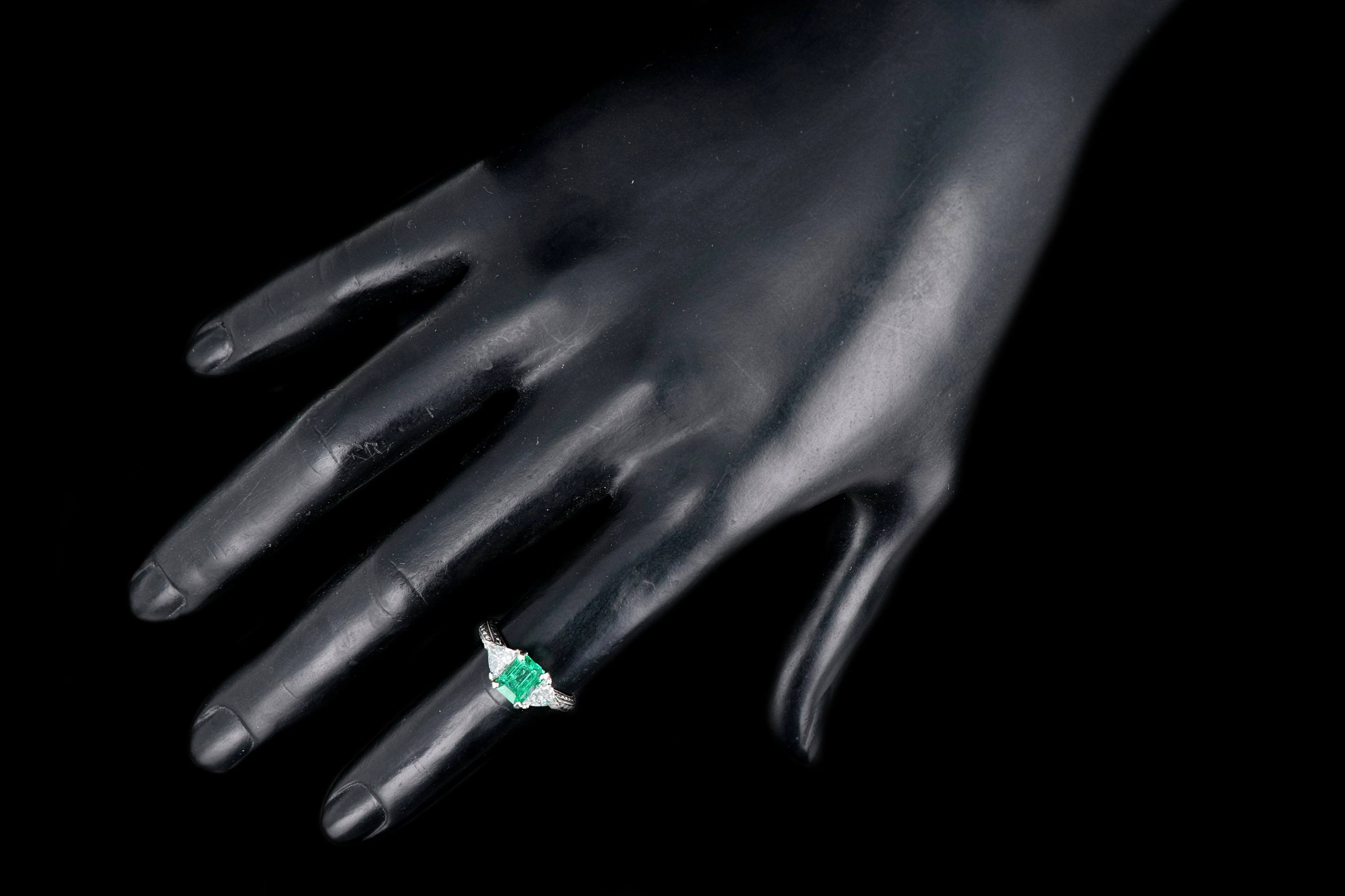 Modern Platinum and 18K Yellow Gold 1 Carat Emerald and Trillion Cut Diamond Ring