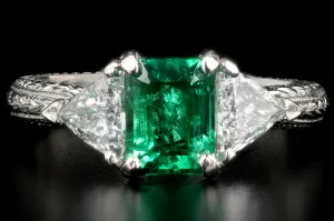 Modern Platinum and 18K Yellow Gold 1 Carat Emerald and Trillion Cut Diamond Ring