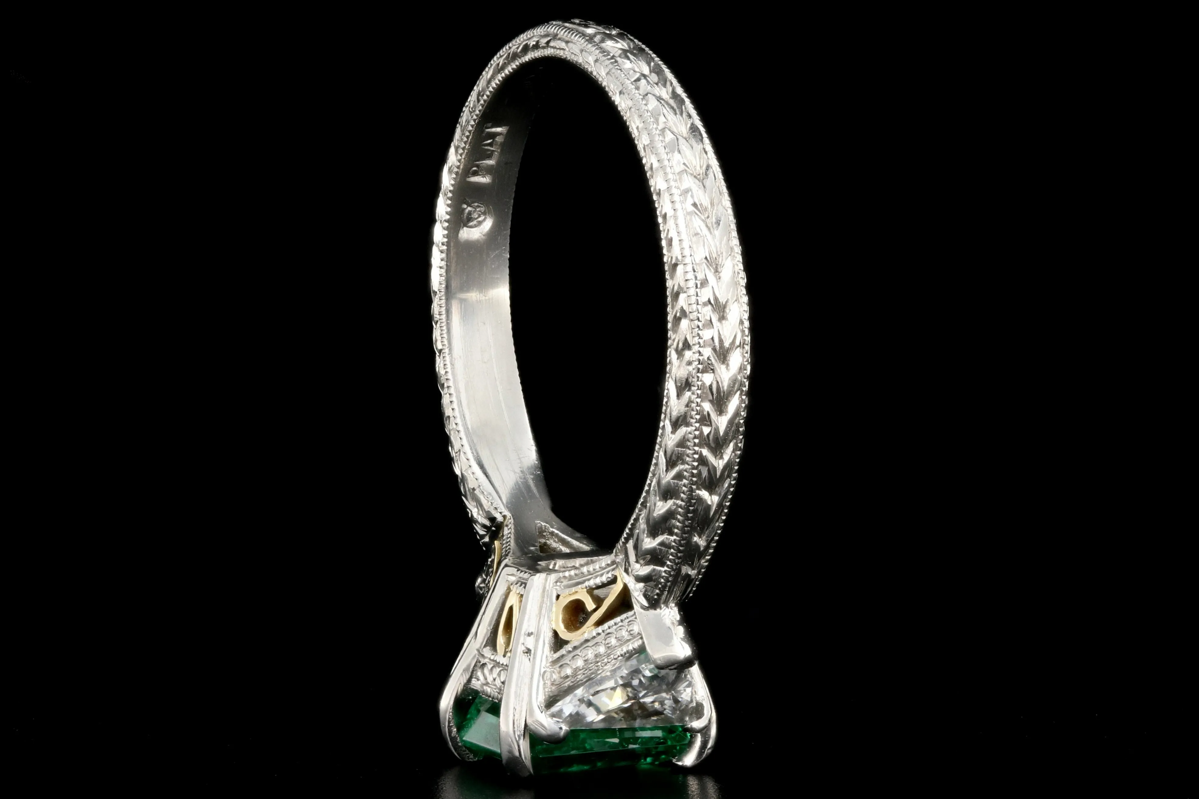 Modern Platinum and 18K Yellow Gold 1 Carat Emerald and Trillion Cut Diamond Ring