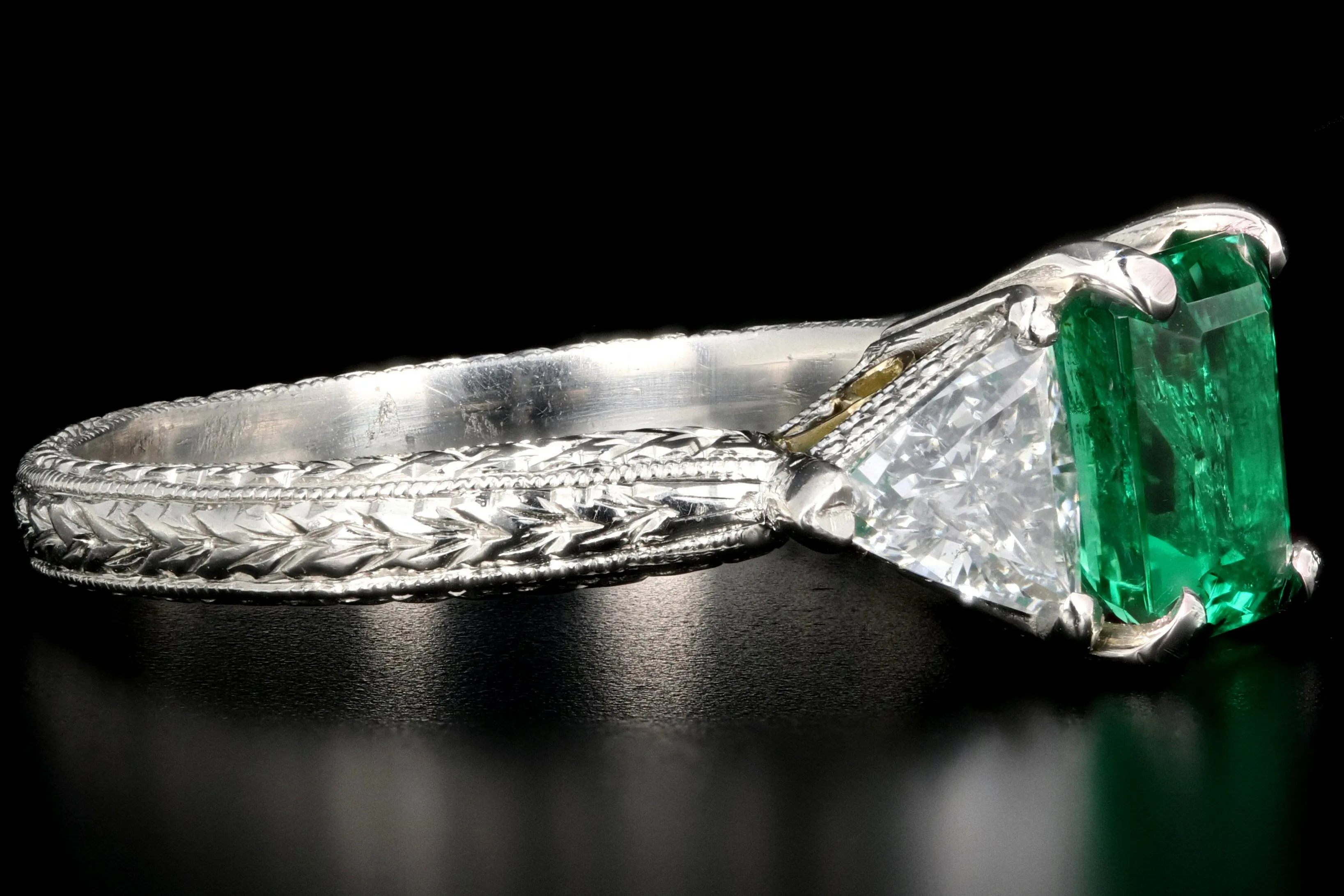 Modern Platinum and 18K Yellow Gold 1 Carat Emerald and Trillion Cut Diamond Ring