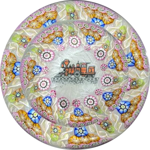 Perthshire Paperweights PP56 Patterned Complex Millefiori on Upset Muslin Cushion with a Train Decal