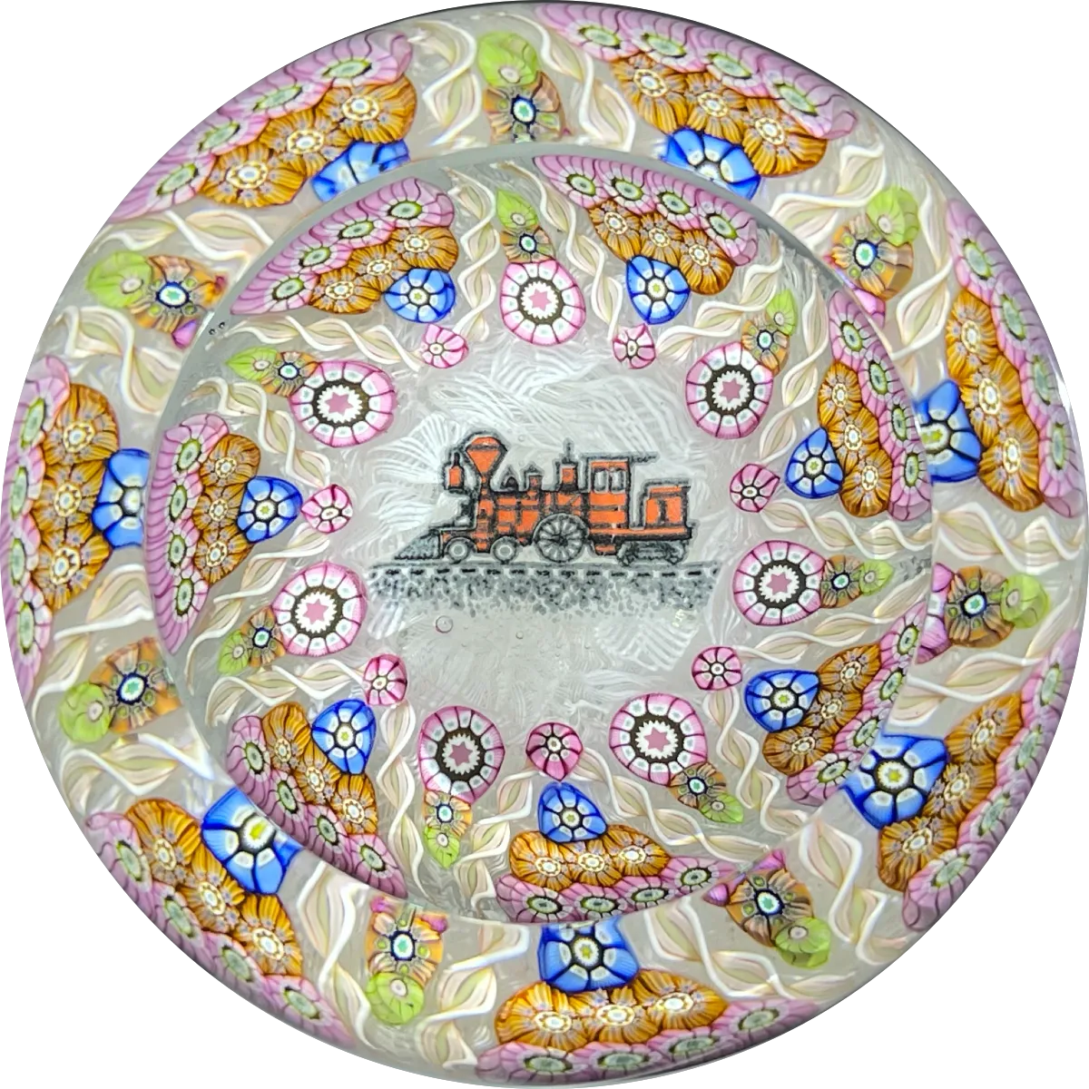 Perthshire Paperweights PP56 Patterned Complex Millefiori on Upset Muslin Cushion with a Train Decal