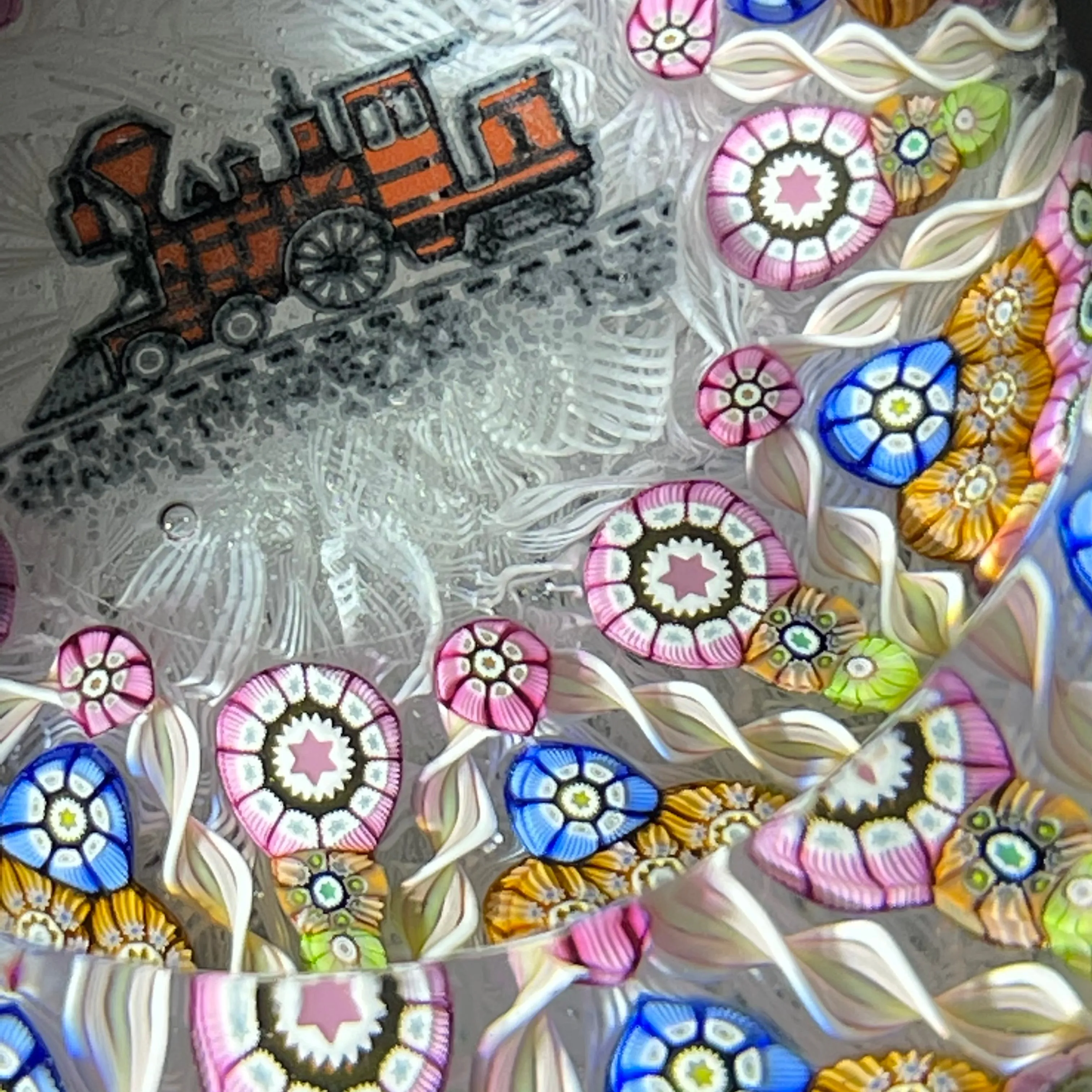 Perthshire Paperweights PP56 Patterned Complex Millefiori on Upset Muslin Cushion with a Train Decal