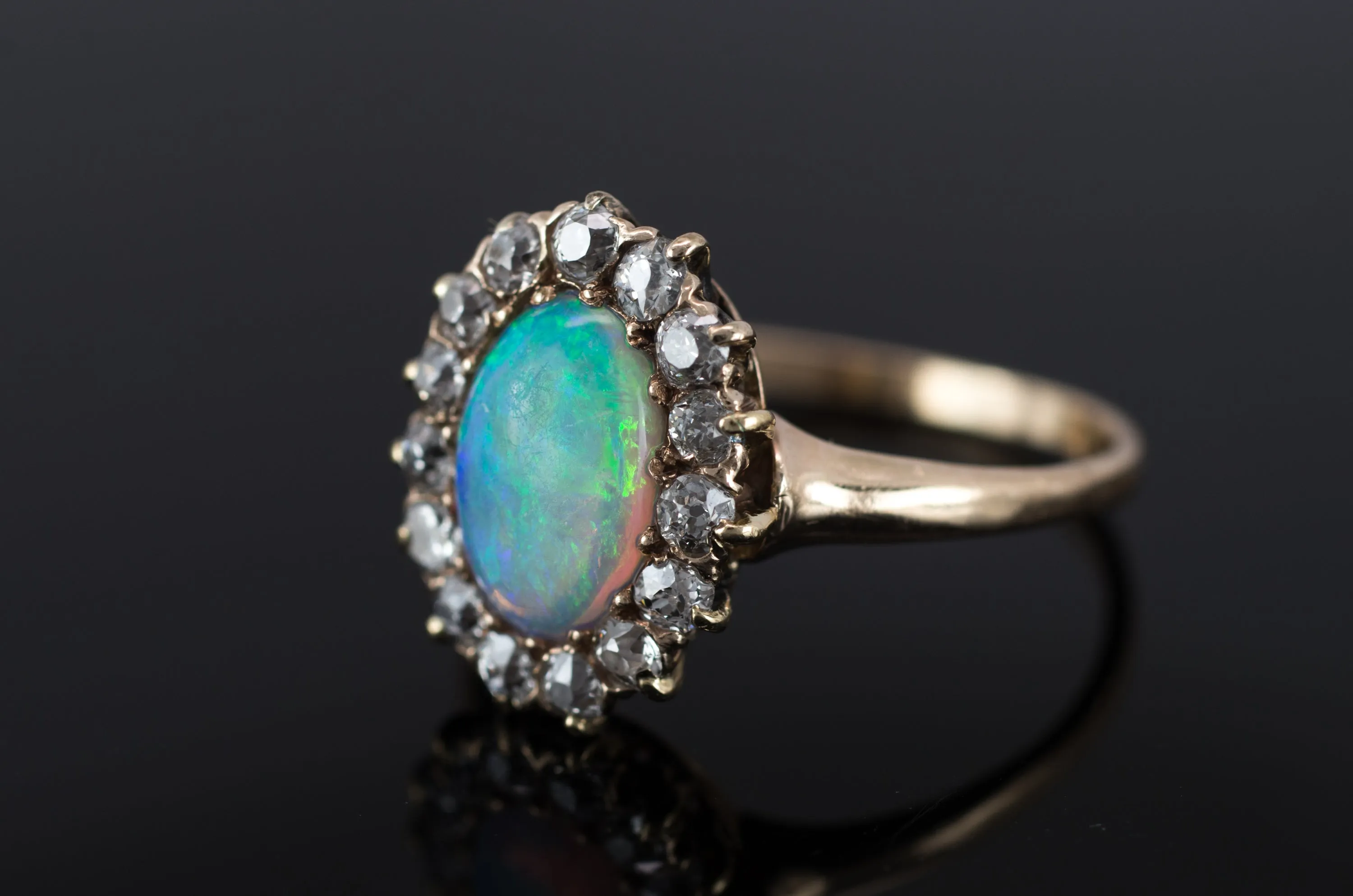 VINTAGE OPAL AND OLD MINE CUT DIAMOND HALO RING