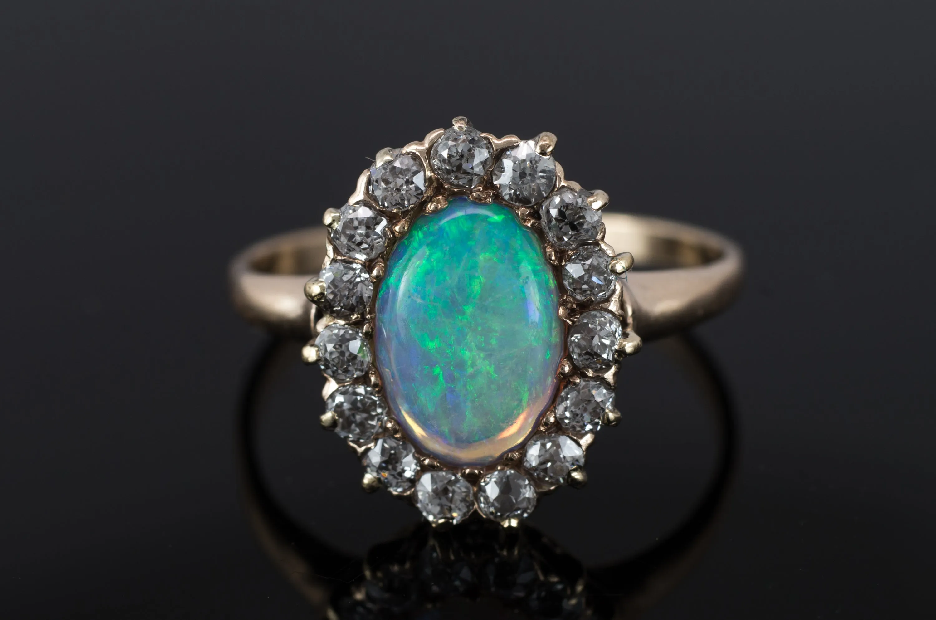 VINTAGE OPAL AND OLD MINE CUT DIAMOND HALO RING