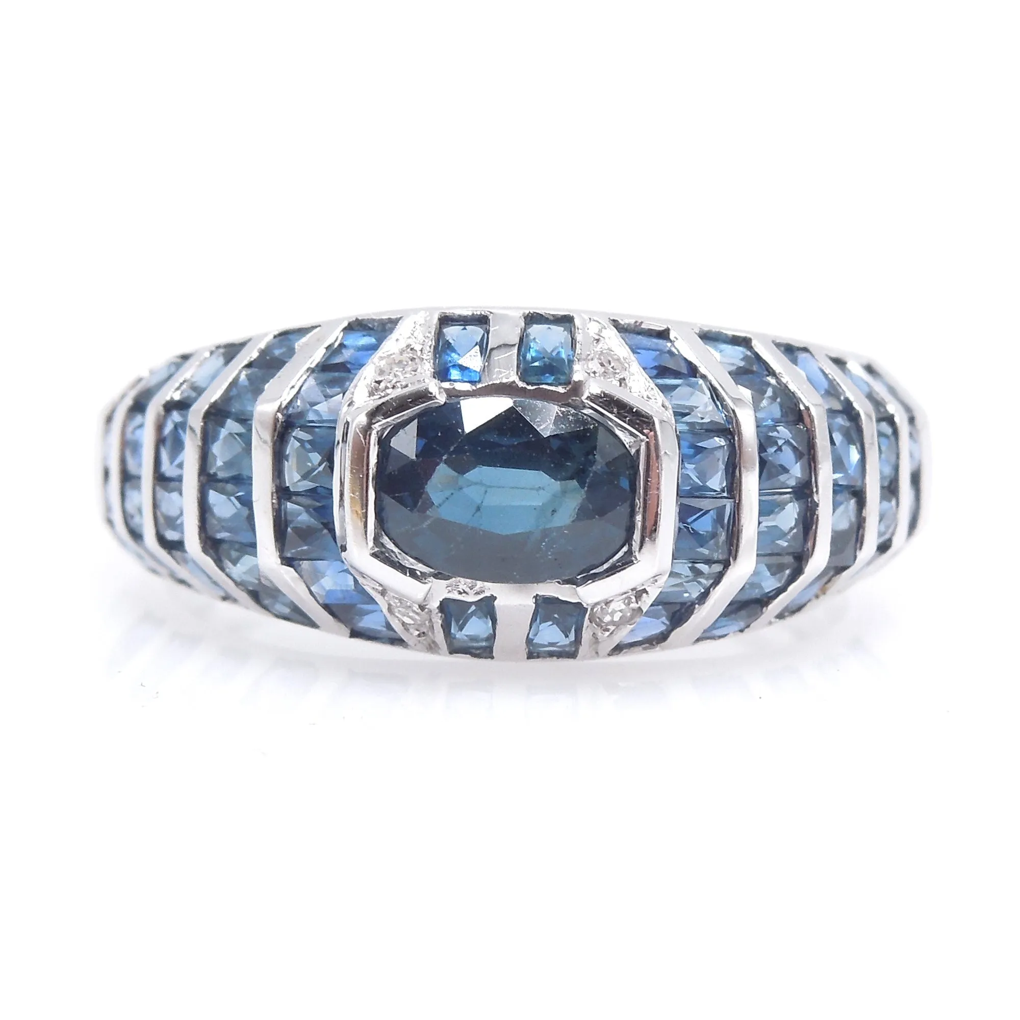 White Gold and Sapphire Bezel and Channel Set Domed Band