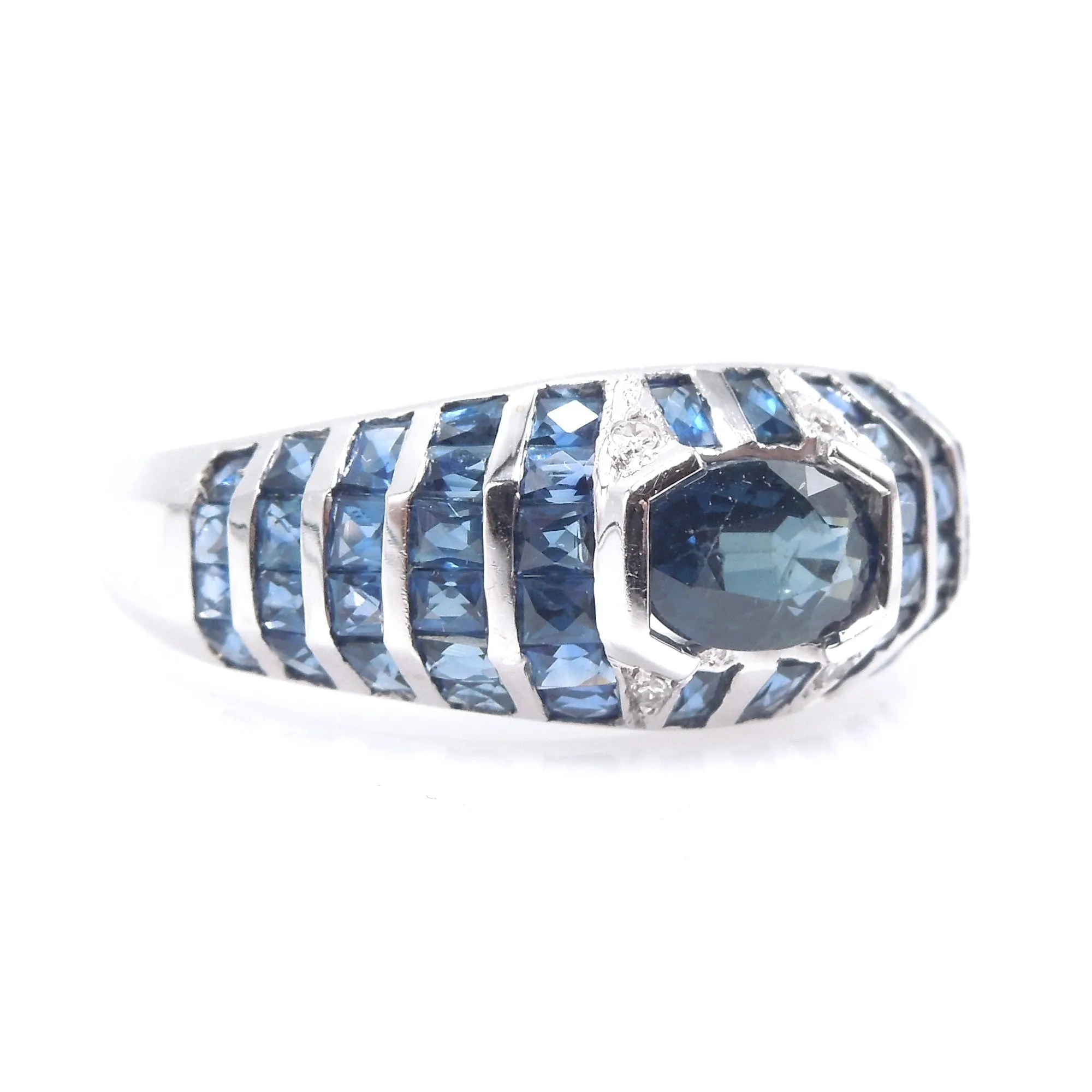 White Gold and Sapphire Bezel and Channel Set Domed Band